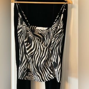 Black and white adjustable spaghetti strap top.  Bundle any three tops for $10.